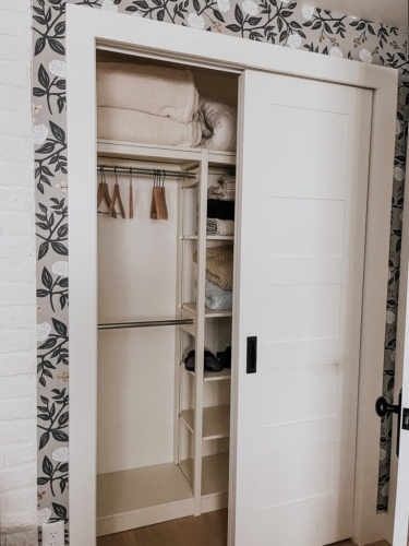 Solid wood Lundia shelving in a bedroom