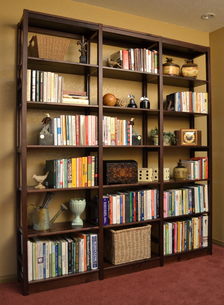 Solid wood kitchen shelving with dishware and pantry items