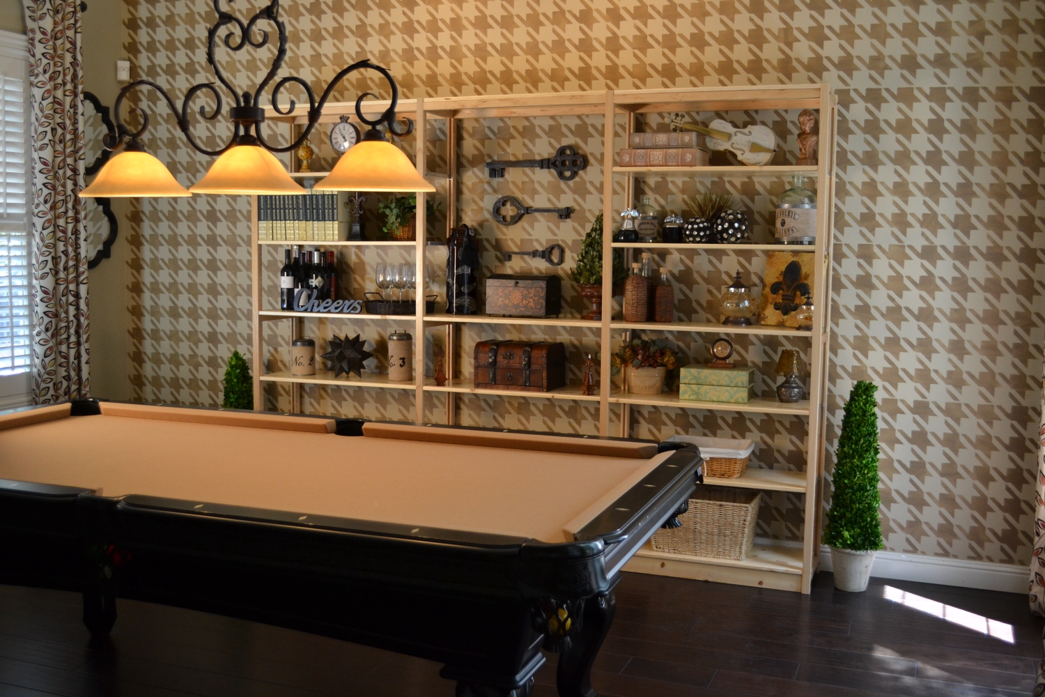 Pine solid wood bookcase decorated with collectibles in a billiards room