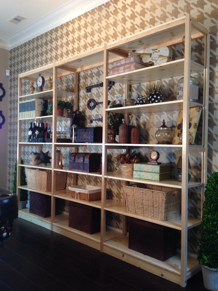 Wide pine solid wood bookcase wall in a pool table room