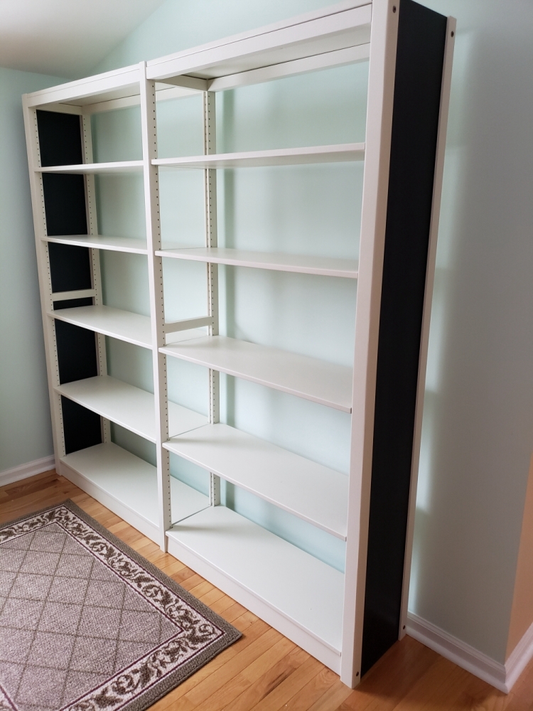 Empty white painted solid wood bookcase starter unit