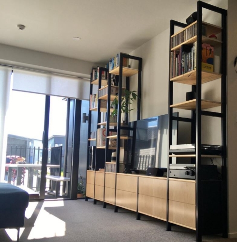 Solid wood Lundia shelving in a residential living space