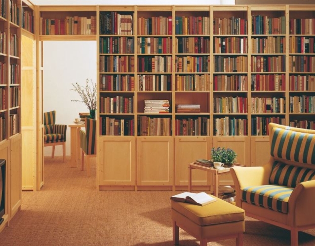 Solid wood Lundia shelving in a residential living space
