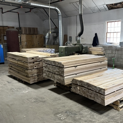 Stacks of solid wood boards in the Lundia shop