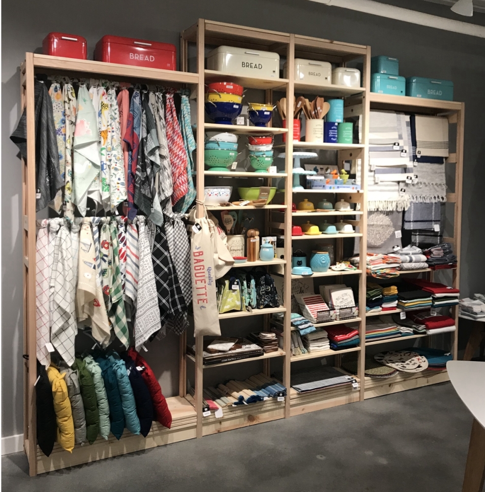 Solid wood modular shelving in a retail boutique store