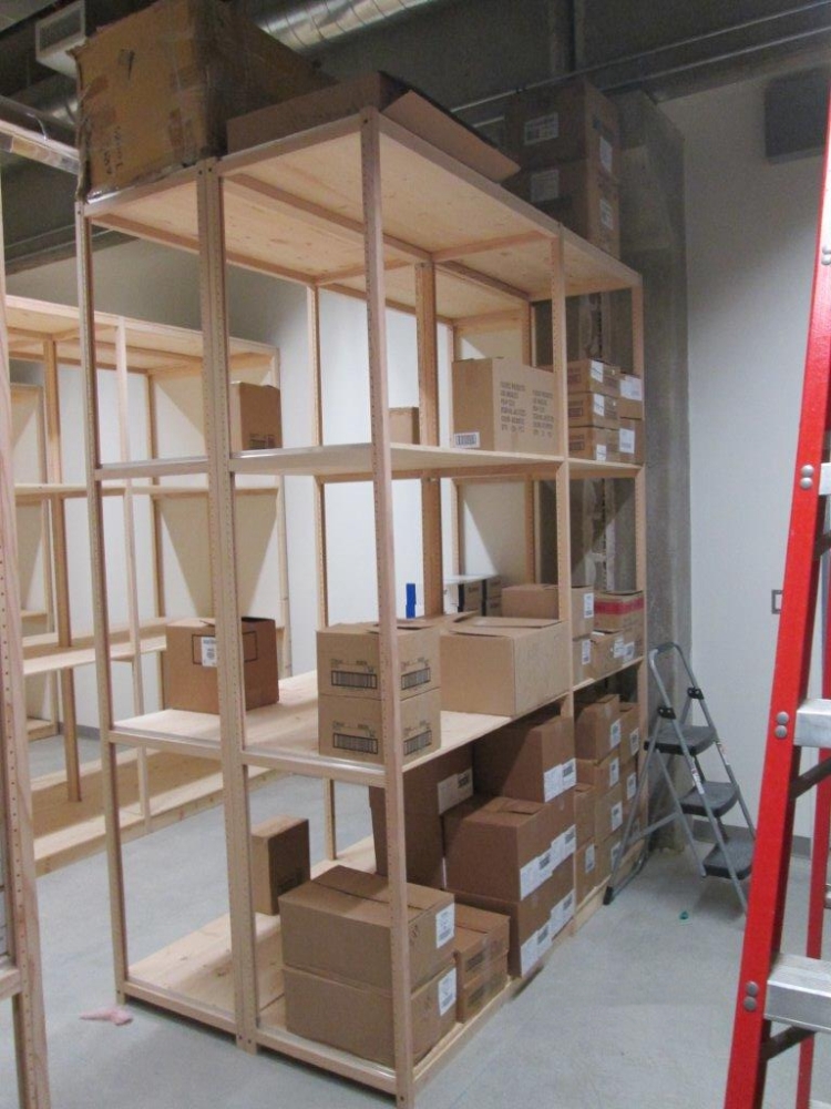 Solid wood warehouse storage shelving with cartons of inventory
